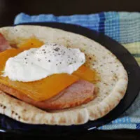 Ham, Cheddar and Poached Egg Pita Breakfast Sandwich