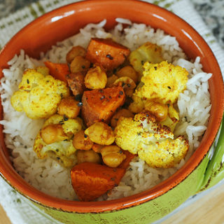 Roasted Cauliflower, Sweet Potatoes and Garbanzo Beans Over Rice