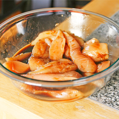 Marinating chicken for Baked Ginger Sesame Chicken and Broccoli