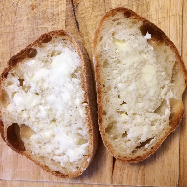 Butter is a good sub for mayo. Here buttered bread slices are shown.