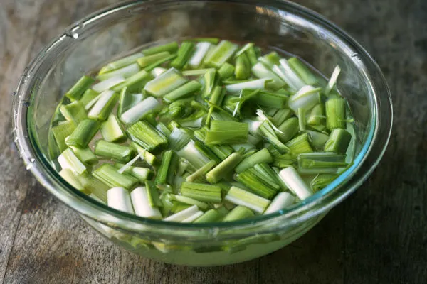 Fresh Leeks Soaking in Water for Chicken Leek Stew with Mashed Potatoes Recipe