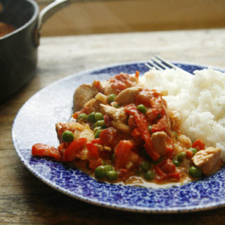 Creamy Tomato Shallot Chicken Skillet with Red Peppers and Peas