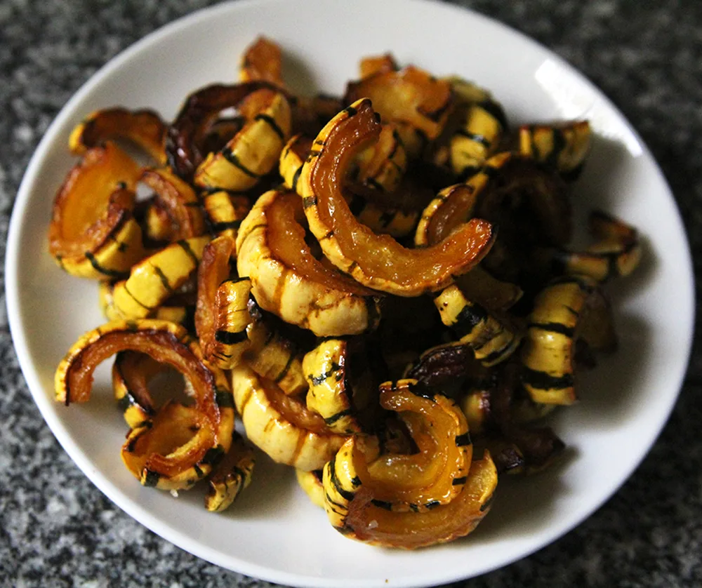 Caramelized and tender, this recipe for Easy Delicata Squash is a lovely way to enjoy this hard squash.