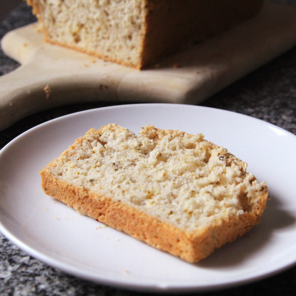 Bread recipes using self-rising flour are quick breads. Carbonated beverages are used to make the loaf rise while it bakes. A slice of bread is shown on a white plate.