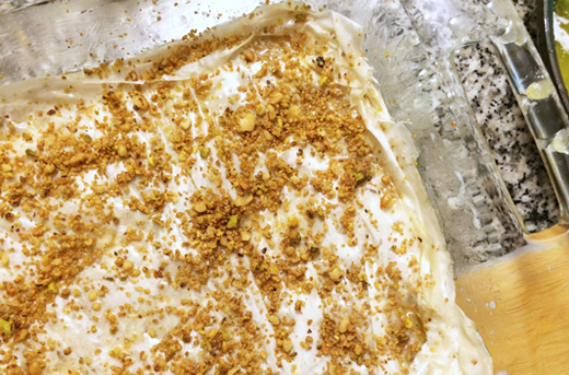 Nuts sprinkled on phyllo dough